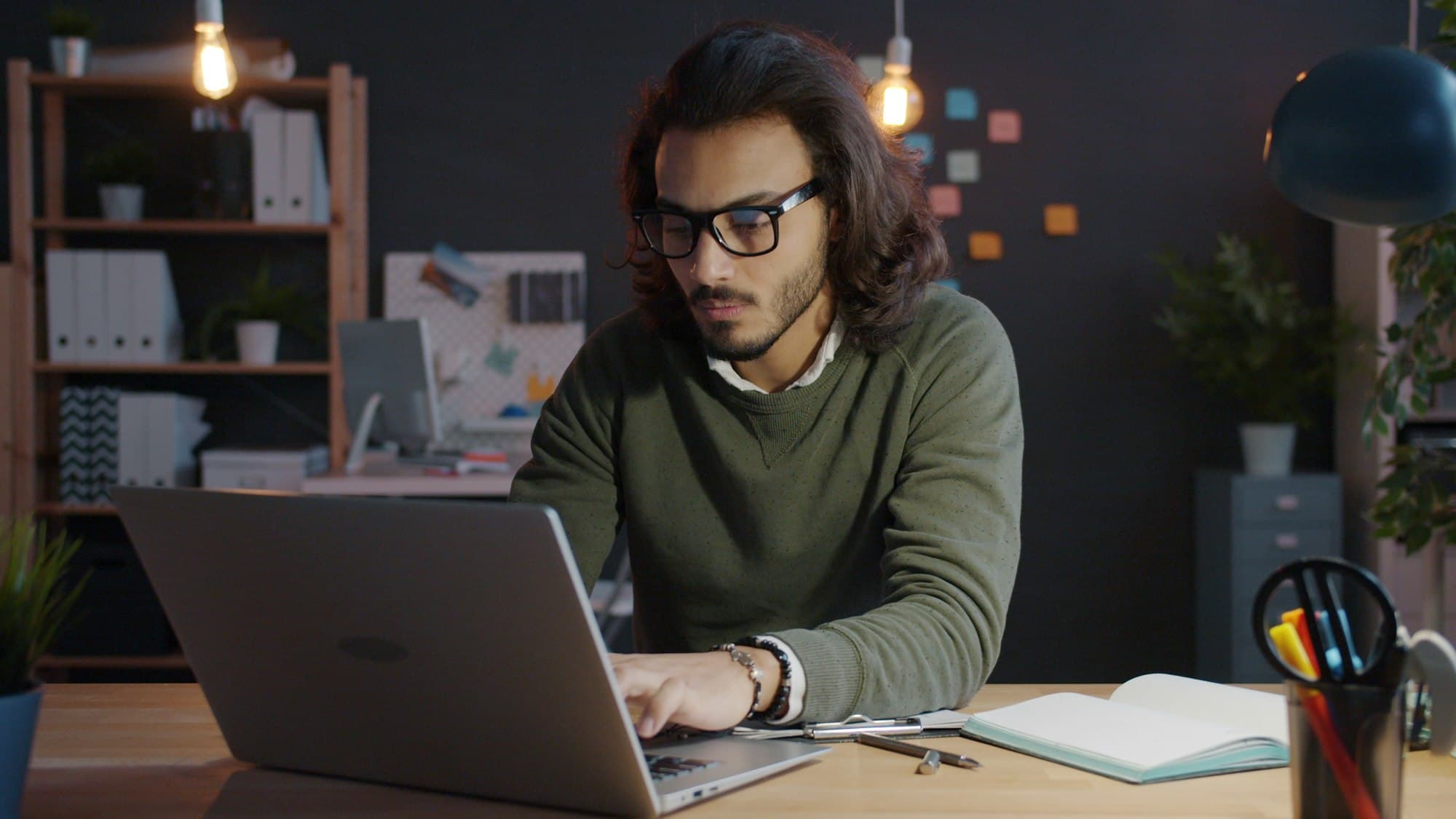 A BootSoc analyst reviewing lead records at a desk